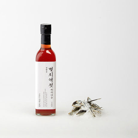 Myeongin Myeongchon anchovy fish sauce, crafted by skilled artisans in Korea and aged for over 3 years with refined salt in an underground warehouse. This premium sauce boasts a clear red hue and a rich, undiluted flavour, ideal for enhancing kimchi, seasonings, stir-fries, and stews.