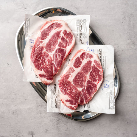 Premium Spanish chestnut-fed Duroc pork collar with rich marbling, perfect for grilling or slow cooking